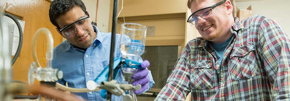 Penn State Hazleton faculty member working with a student in the chemistry lab.