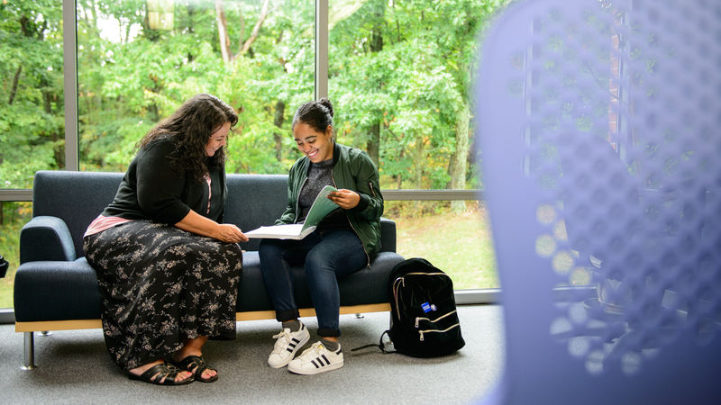 Learning Center Coordinator Tammy Spevak works with a student in the center.