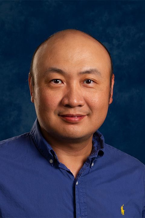 Professor Zugang (Leo) Liu with blue background