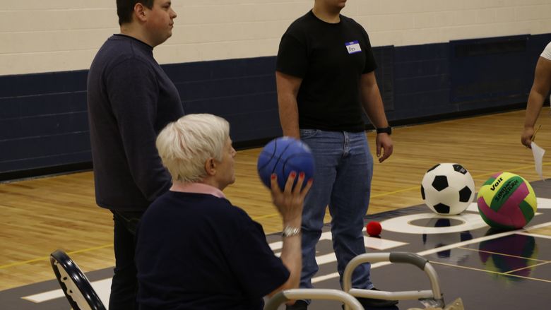 Penn State Hazleton Rehabilitation and Human Services (RHS) students interact with a local resident during a prior Penn State in Motion program. 