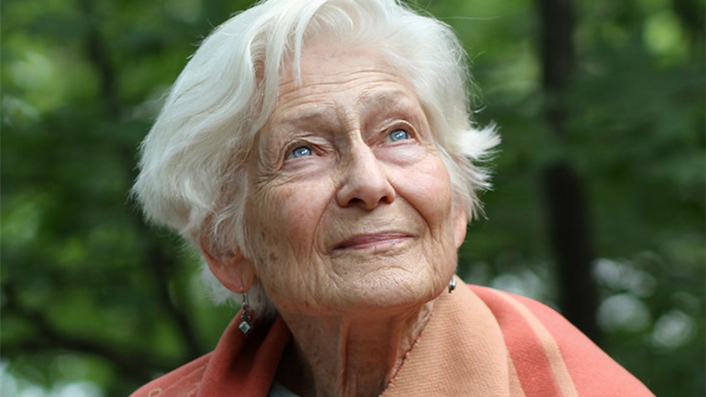 Irene Butter, a smiling woman with gray hair and blue eyes.