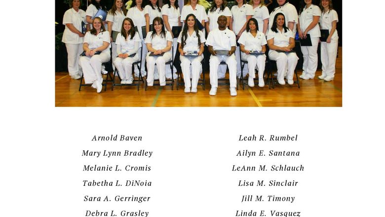 Group of nurses in white scrubs in two rows