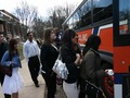 Students entering a charter bus