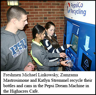 Students recycle bottles and cans in the Pepsi dream machine. 