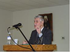 Sergei Horujy speaking at a podium