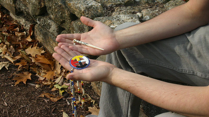 James Modico holds some of the craft items made by Lakota Indians.