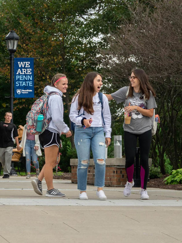 Students walking along campus mall.