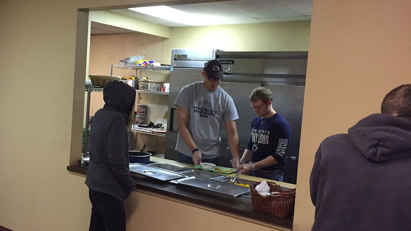 Rehabilitation and Human Services students work alongside Assistant Professor of Rehabilitation and Human Services Garrett Huck to serve lunch at the Salvation Army soup kitchen in downtown Hazleton.