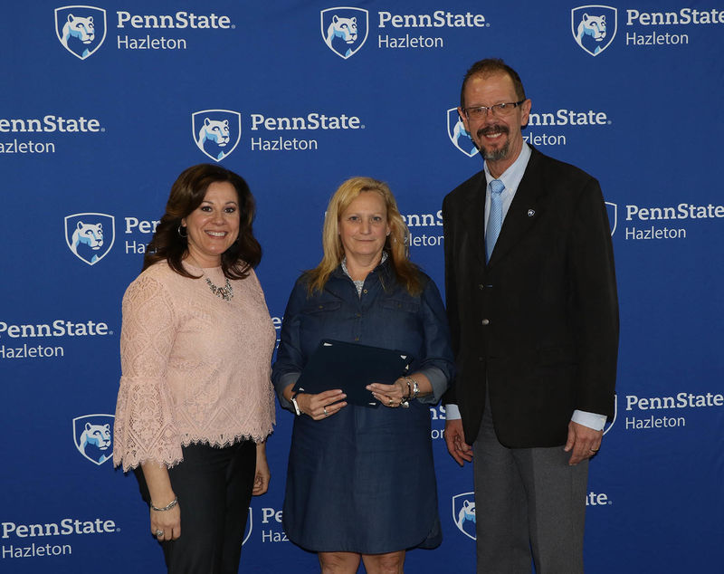 Bonnie Sukana, staff assistant, was honored for 20 years of service. She is pictured with Director of Student Services and Engagement Tracy Garnick and Chancellor Gary Lawler.
