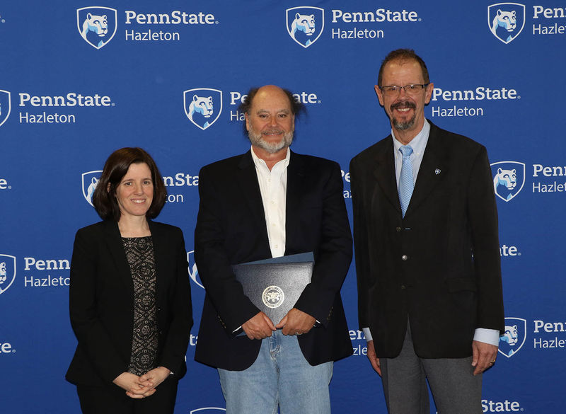 Peter Crabb, professor of psychology, was honored for 25 years of service. He is pictured with Director of Academic Affairs Elizabeth Wright and Chancellor Gary Lawler.