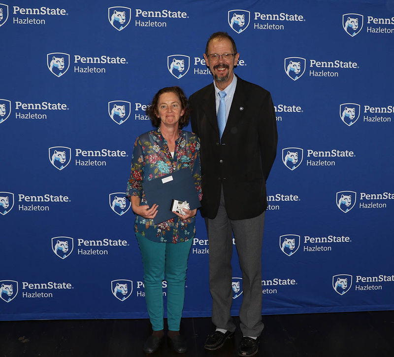 Margaret Froehlich, associate professor of English, pictured with Chancellor Gary Lawler, was one of the employees honored for 10 years of service.