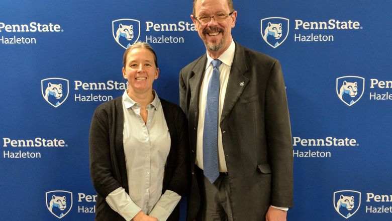 Patrice Lombard, records specialist, was honored for 15 years of service. She is pictured with Chancellor Gary Lawler.