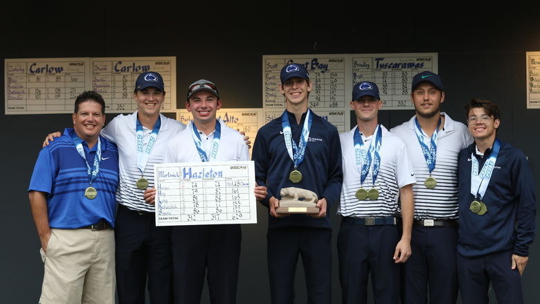 Group of golfers standing in a row wearing medals.