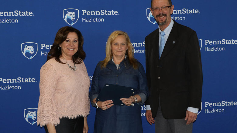 Bonnie Sukana, staff assistant, was honored for 20 years of service. She is pictured with Director of Student Services and Engagement Tracy Garnick and Chancellor Gary Lawler.