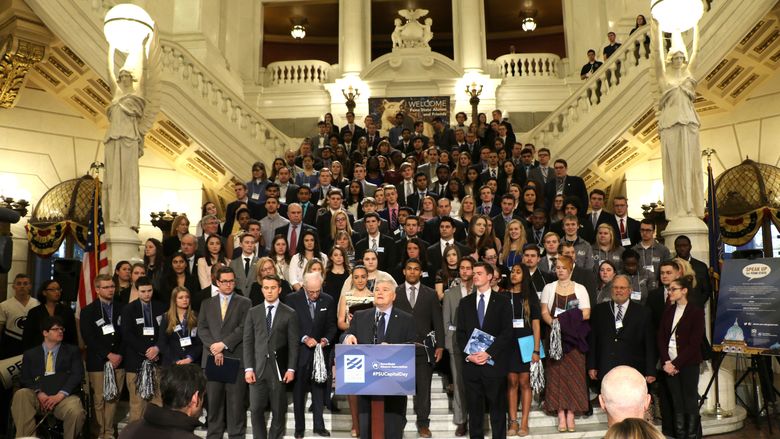 Penn Staters rally in the Capitol rotunda to show their support for the University.