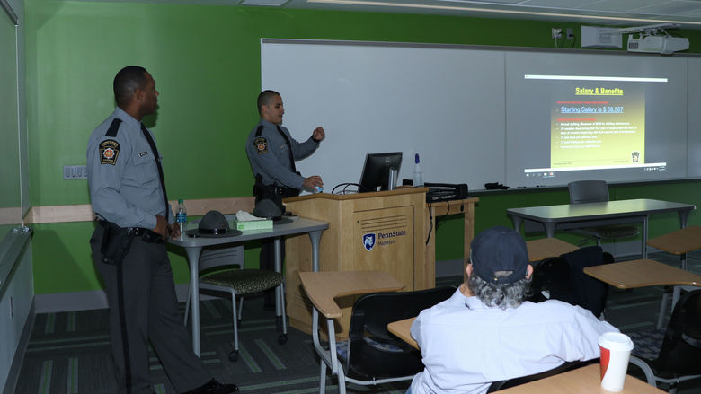 Trooper Marvin Armistead, left, and Trooper David Myers address Daniel Gutierrez’ “Policing in America” class at Penn State Hazleton.