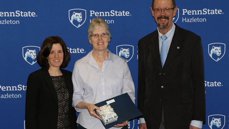Patricia Ferry, instructor in and coordinator of medical laboratory technology, was honored for 35 years of service. She is pictured with Director of Academic Affairs Elizabeth Wright and Chancellor Gary Lawler.