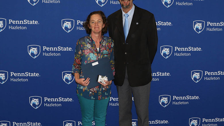 Margaret Froehlich, associate professor of English, pictured with Chancellor Gary Lawler, was one of the employees honored for 10 years of service.