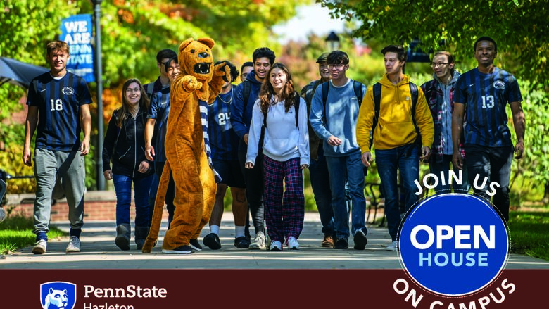 Students walking along campus mall in a row with Nittany Lion