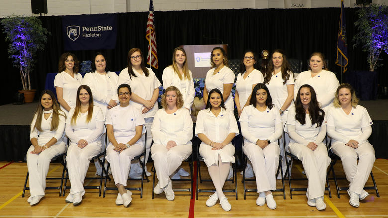 Practical Nursing graduates seated in two rows
