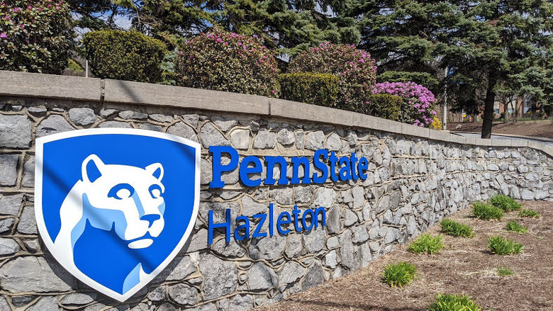 Penn State Hazleton sign on stone wall leading onto campus