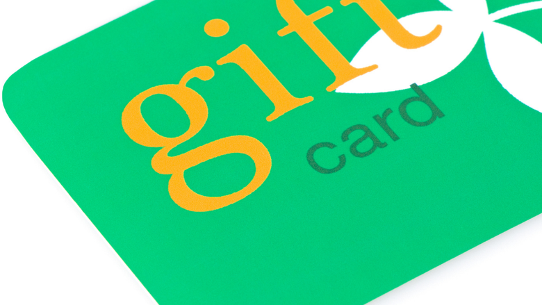 Green gift card with white flower pedals