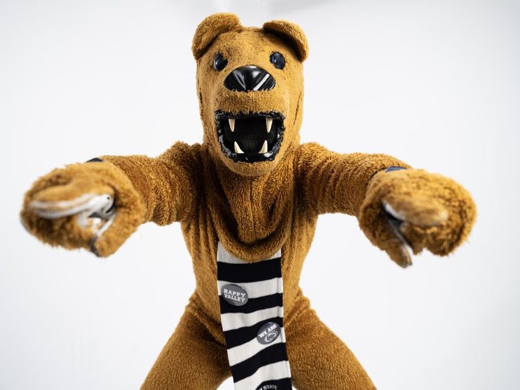 The Nittany Lion points to the camera with both hands