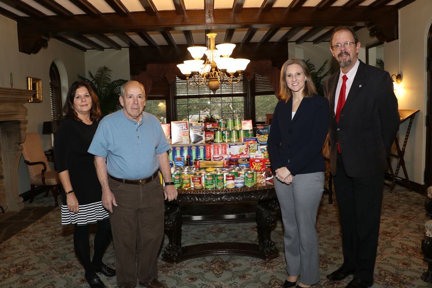 From left: Jaculin Scarcella, alumni and development stewardship officer; Rocco Formica, alumni chapter president; Christen Reese, director of development; and Gary Lawler, chancellor. The chapter oversees the food drive each year at the campus.