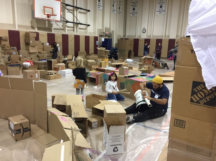 Photograph of gymnasium interior with cardboard boxes