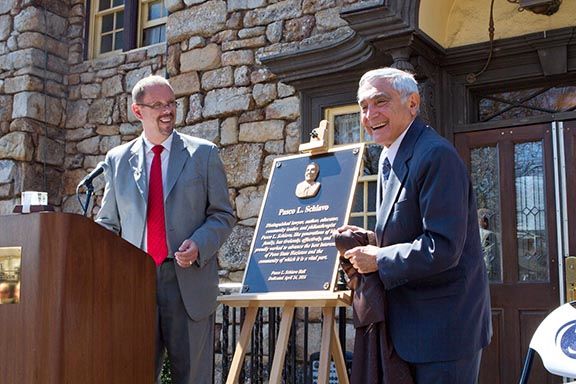 University benefactor Pasco Schiavo, right, has endowed the Pasco L. Schiavo Open Doors Scholarship. Chancellor Gary Lawler is at left during the naming of the Penn State Hazleton administration building in Schiavo's honor in 2014.