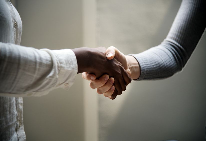 women shaking hands