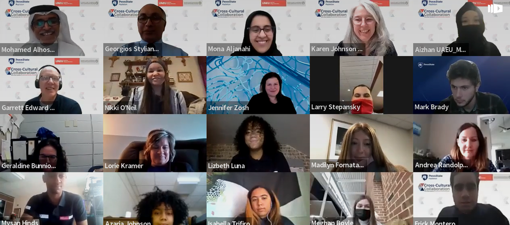 Group of students and university officials smiling and waving during a Zoom meeting.