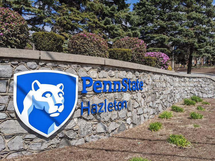 Penn State Hazleton sign on stone wall leading onto campus