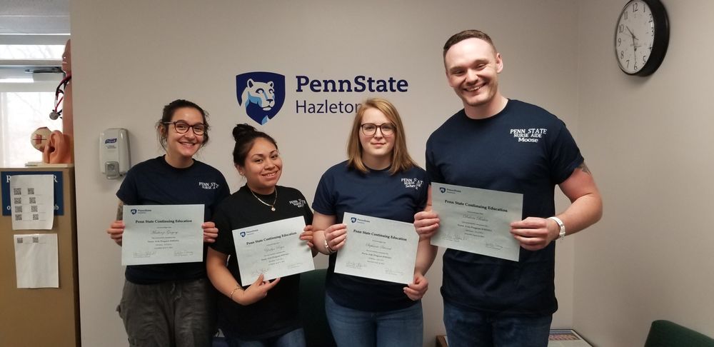 Nurse aide graduates are, from left: Mackenzi Gregory, Yoselyn Reyes, Stephanie Sehenuk and aide Dakota Baker.