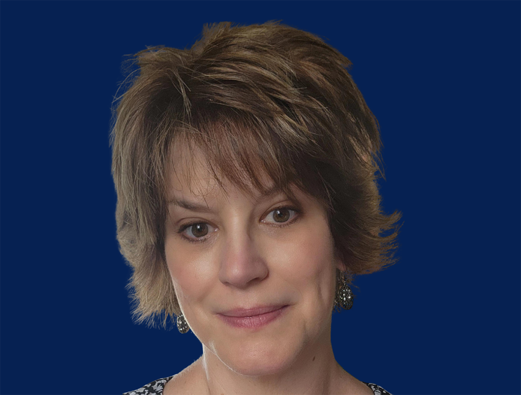 Close up photo of woman with light brown hair.